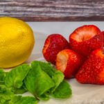 lemon, strawberries and mint leaves